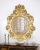 Фигурное зеркало в резной раме 123х101 см Di Biase 70124 золото